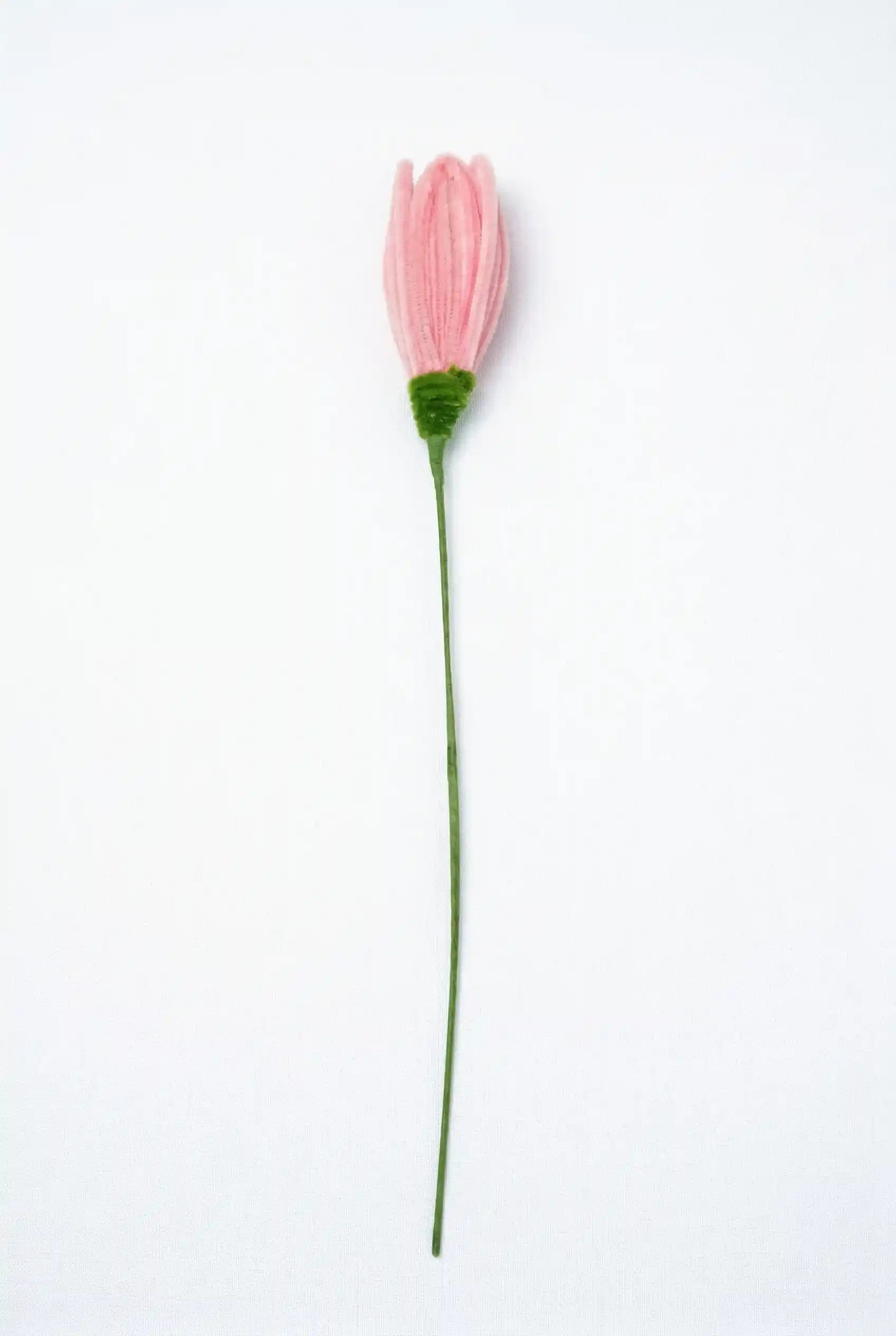 Full stem view of a finished artisan-made pink lotus bud, a perfect zen decor piece for minimalist homes.