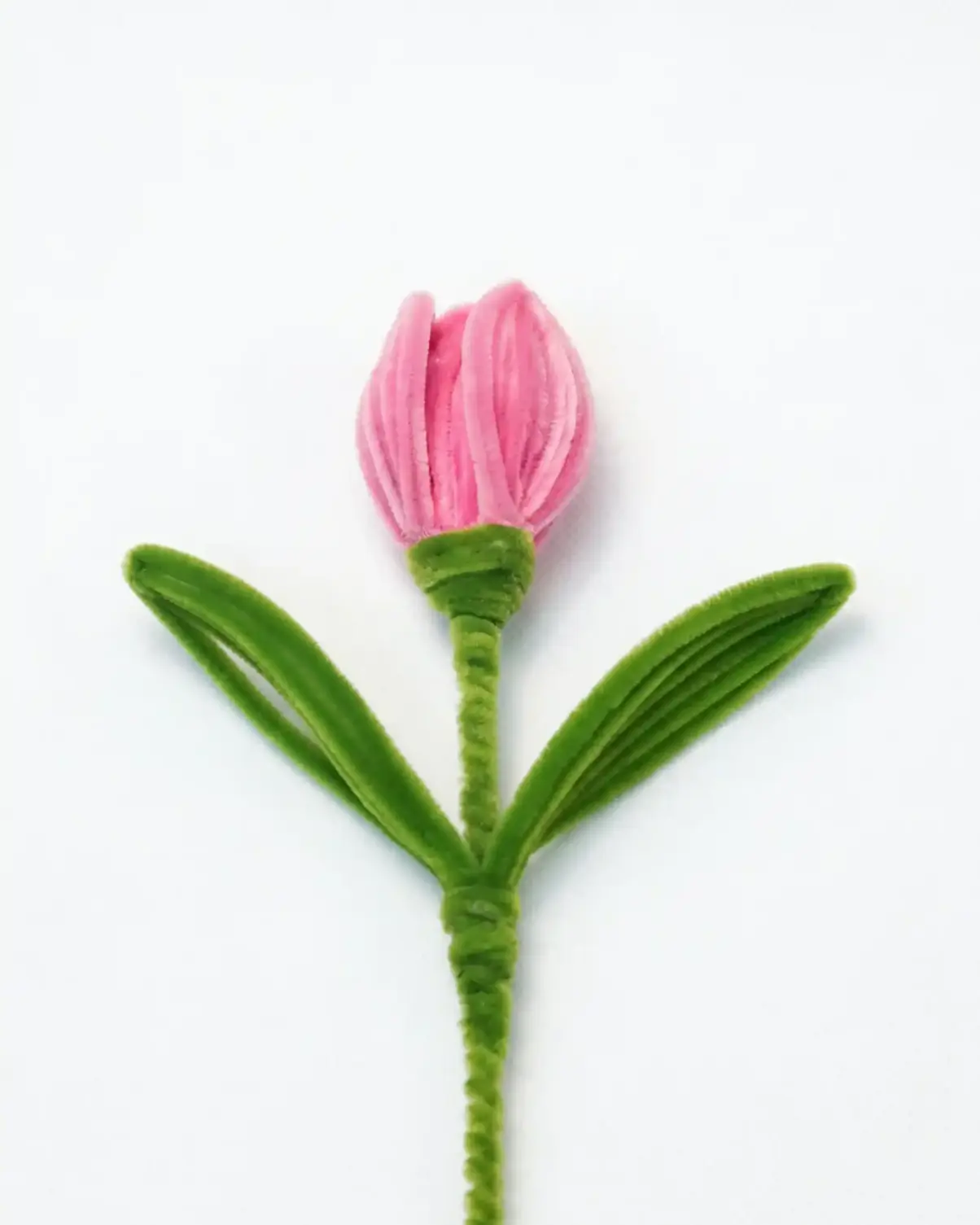 A finished artisan-made pink tulip on a long stem, a perfect everlasting floral piece for minimalist home decor.