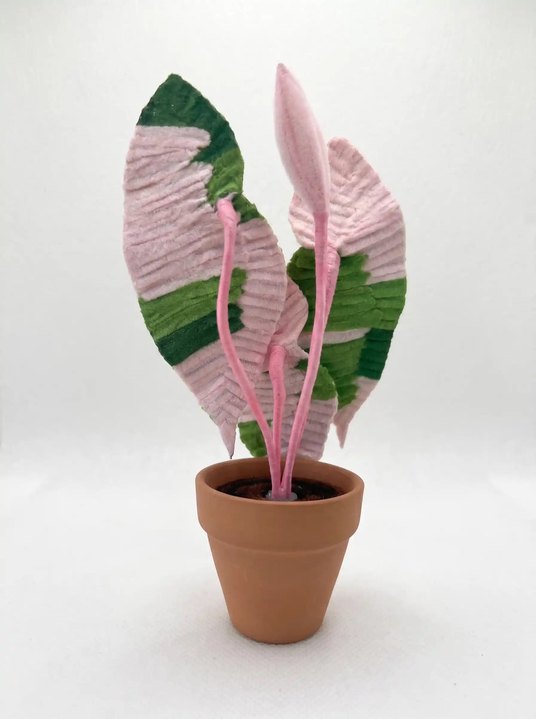 Back view of a handcrafted chenille stem Begonia plant, showing the detailed leaf veins and structure.