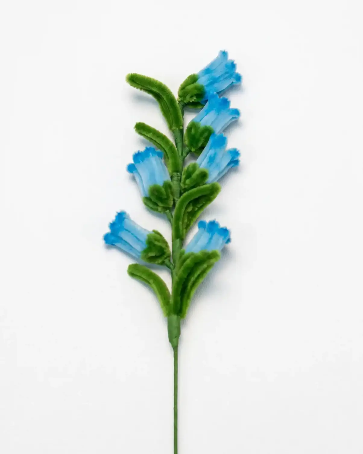Close-up of a handcrafted chenille bluebell flower cluster showing the delicate bell-shaped structure.