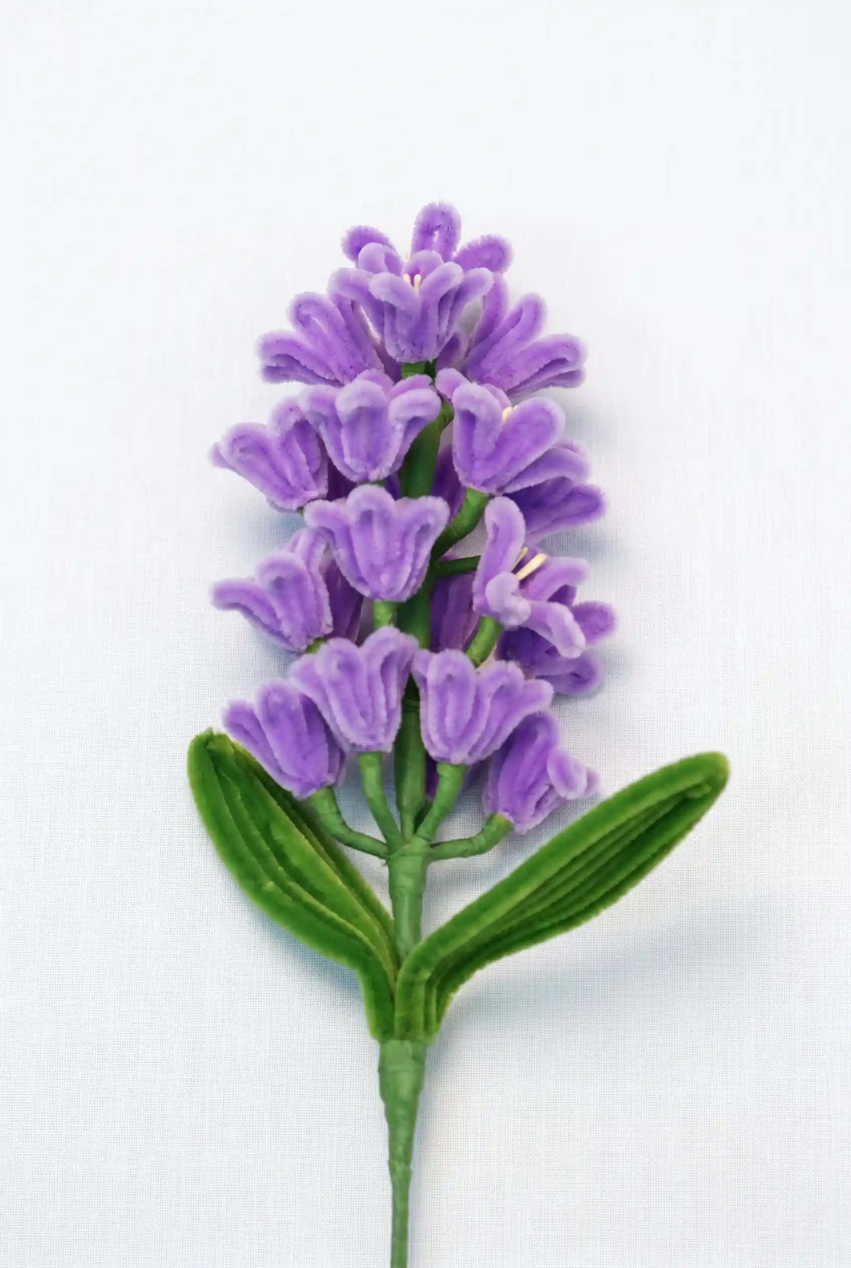 Close-up of a handcrafted chenille hyacinth flower cluster showing the intricate multi-bloom structure.